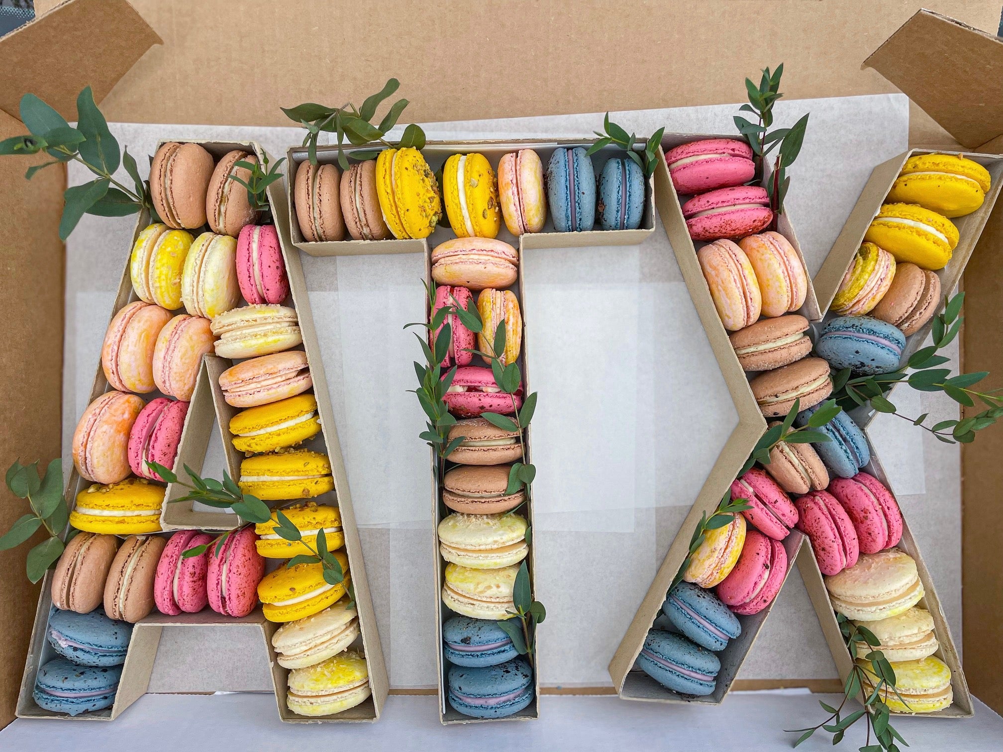Macarons on a Mission - New item! Macaron number/letter boxes 📦 This order  was for 18 macs, so I cut the top off large paper mache numbers and put  them inside. These